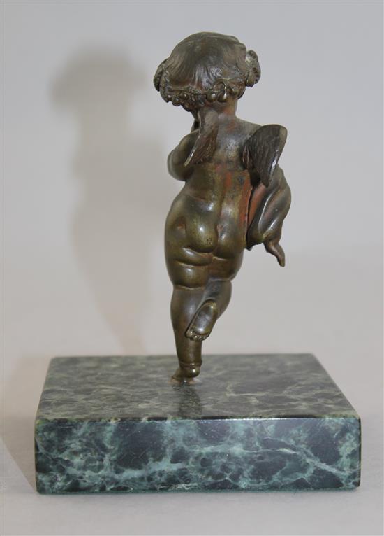 A Continental patinated bronze model of Cupid, 5.5in.